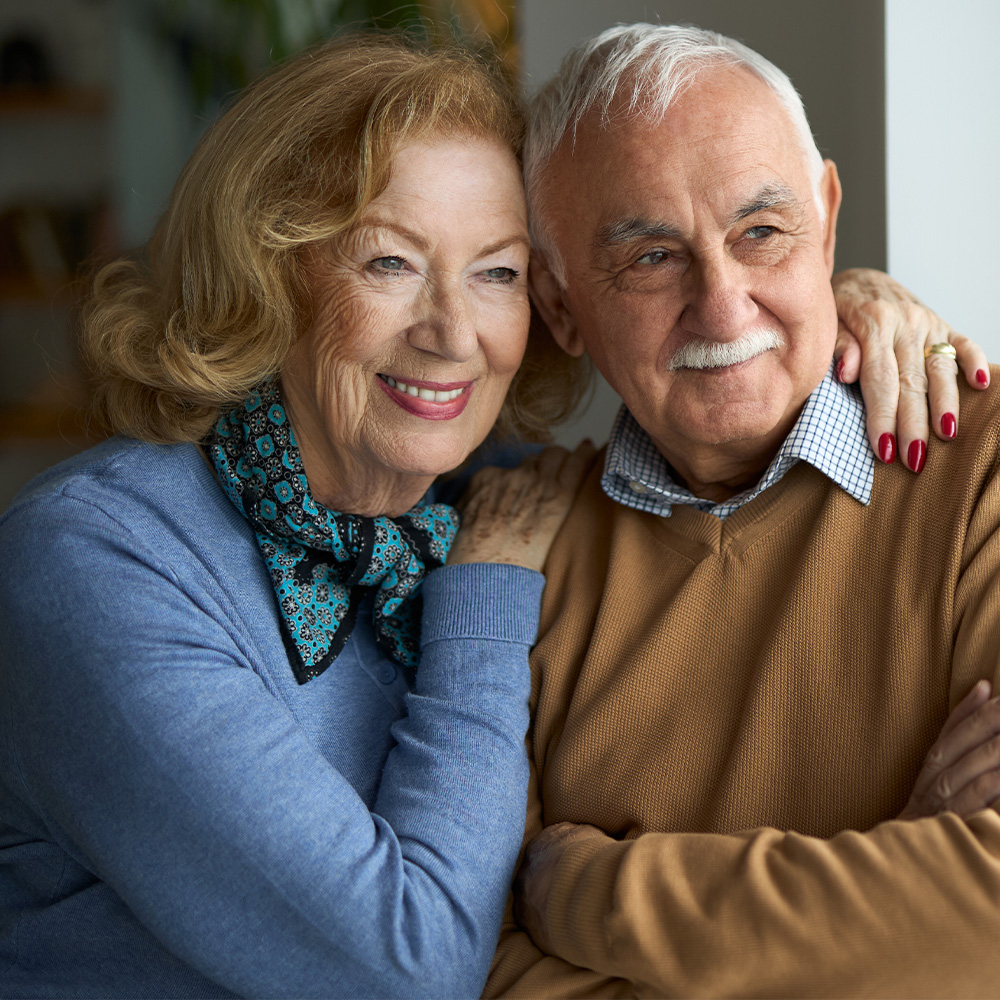 Smiling older couple — cataract surgery patients